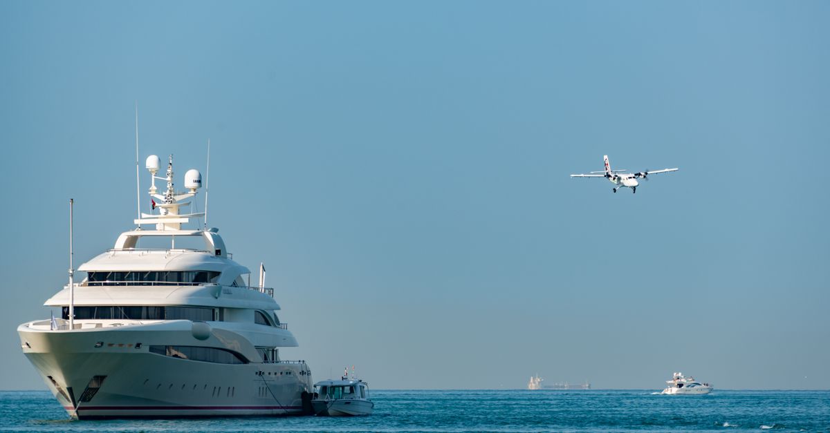 Guests enjoying champagne on a yacht deck